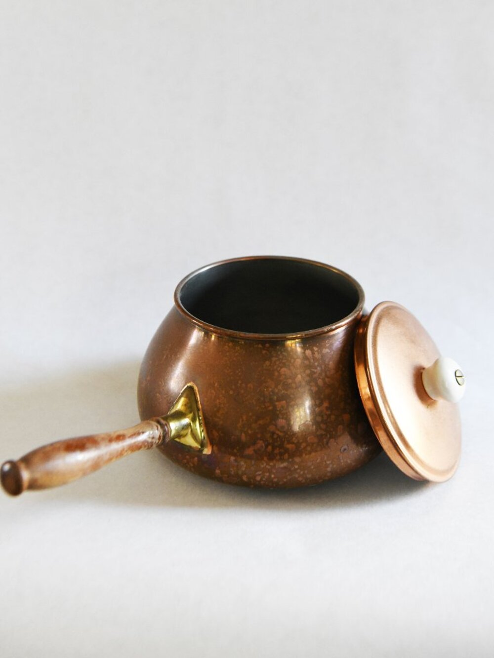 A copper and ceramic warming pot from Tagus Portugal